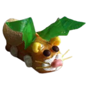 a twinkie monster ith whiskers and eyes and wings