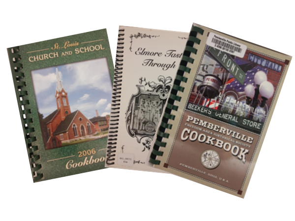 group of three community cookbooks